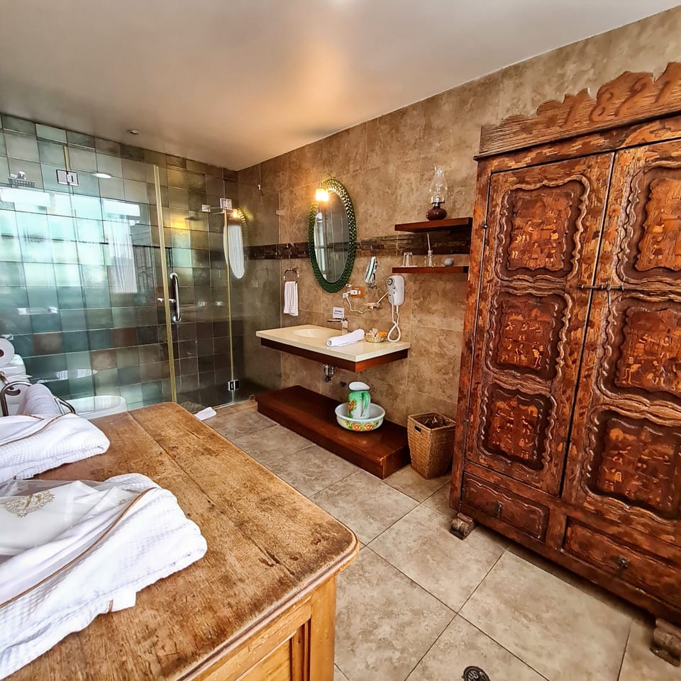 Deluxe Triple Room, Hill View | Bathroom | Designer toiletries, hair dryer, bathrobes, slippers