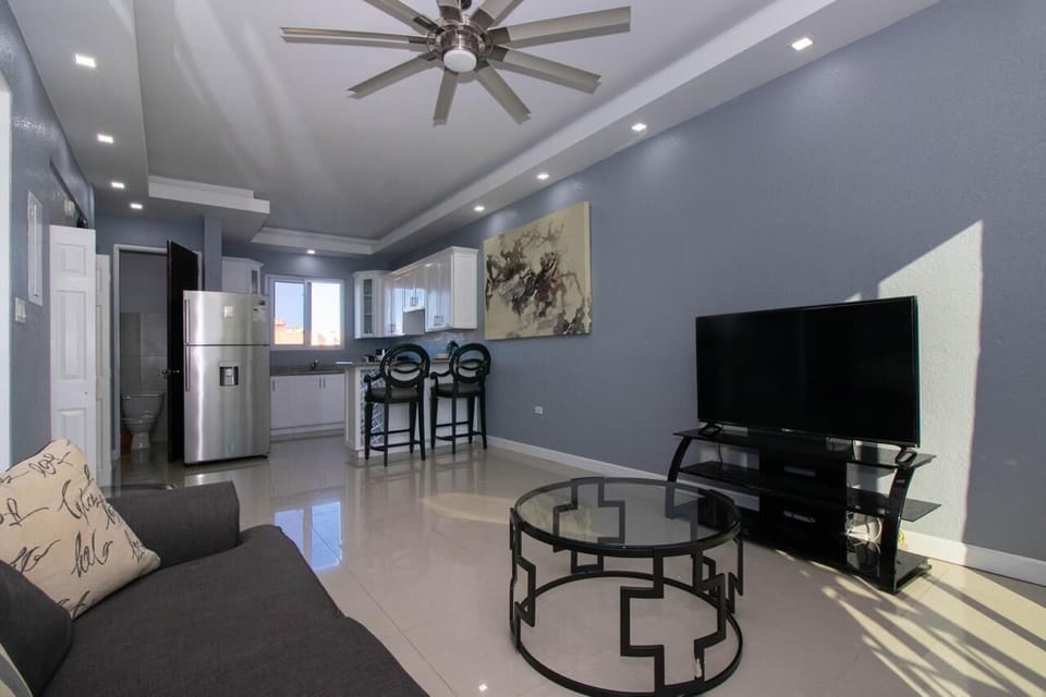 Luxury Apartment | Living area | 65-inch Smart TV with cable channels, TV
