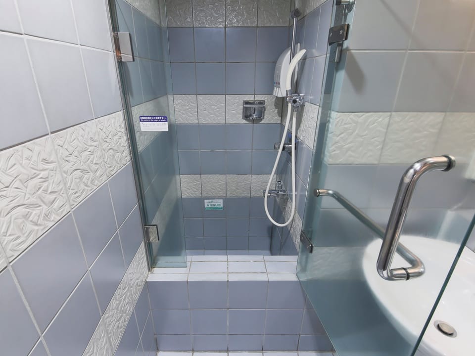 Shower, free toiletries, hair dryer, slippers