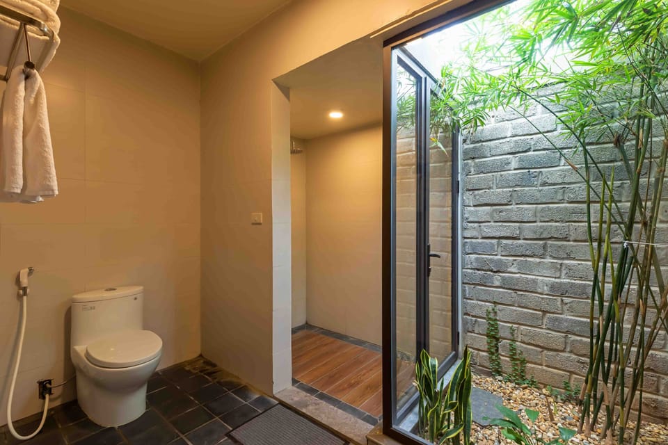 Deluxe Family Room | Bathroom | Shower, free toiletries, hair dryer, slippers