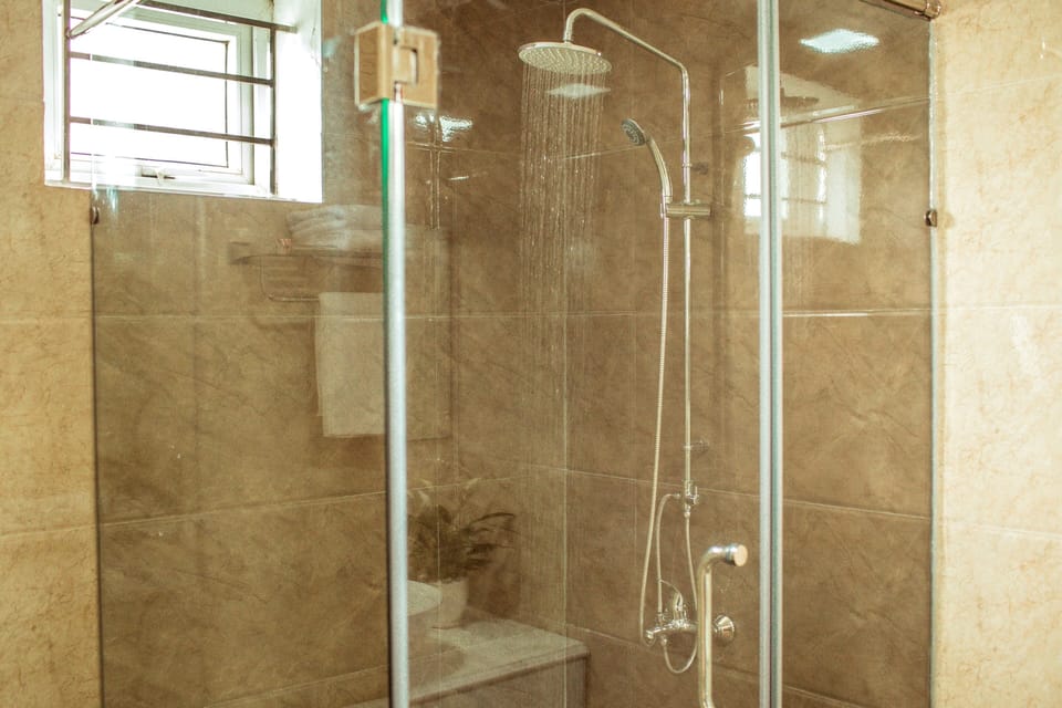 Shower, free toiletries, slippers, towels