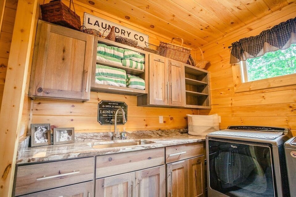 Large laundry with granite countertops & high capacity washer/dryer