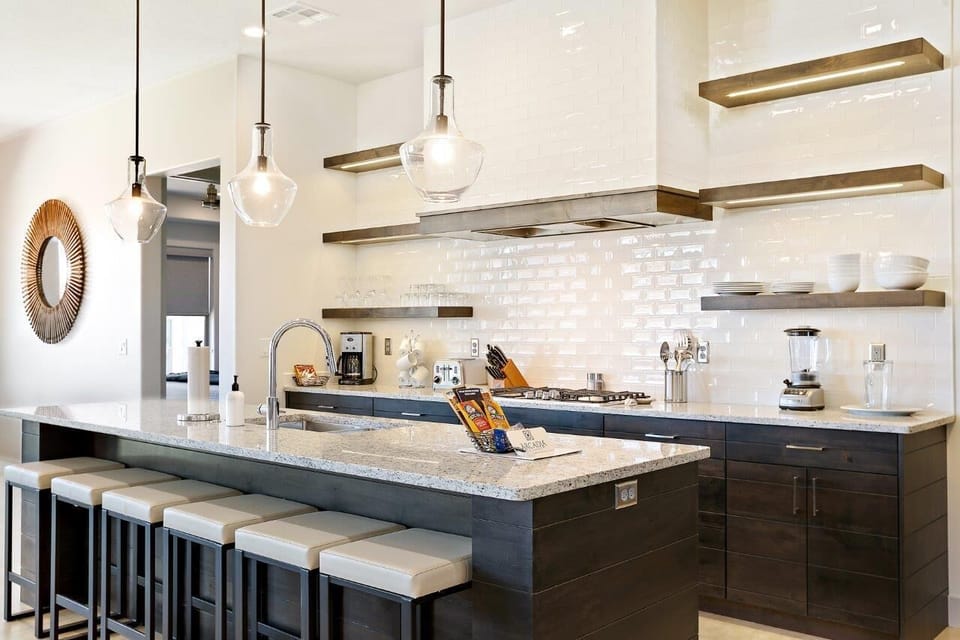 Kitchen is stocked with a variety of appliances and utensils to make cooking a breeze