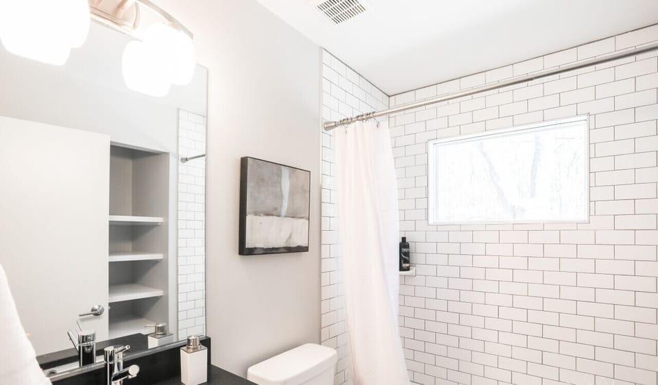 Full bathroom with shampoo, conditioner, and body wash
