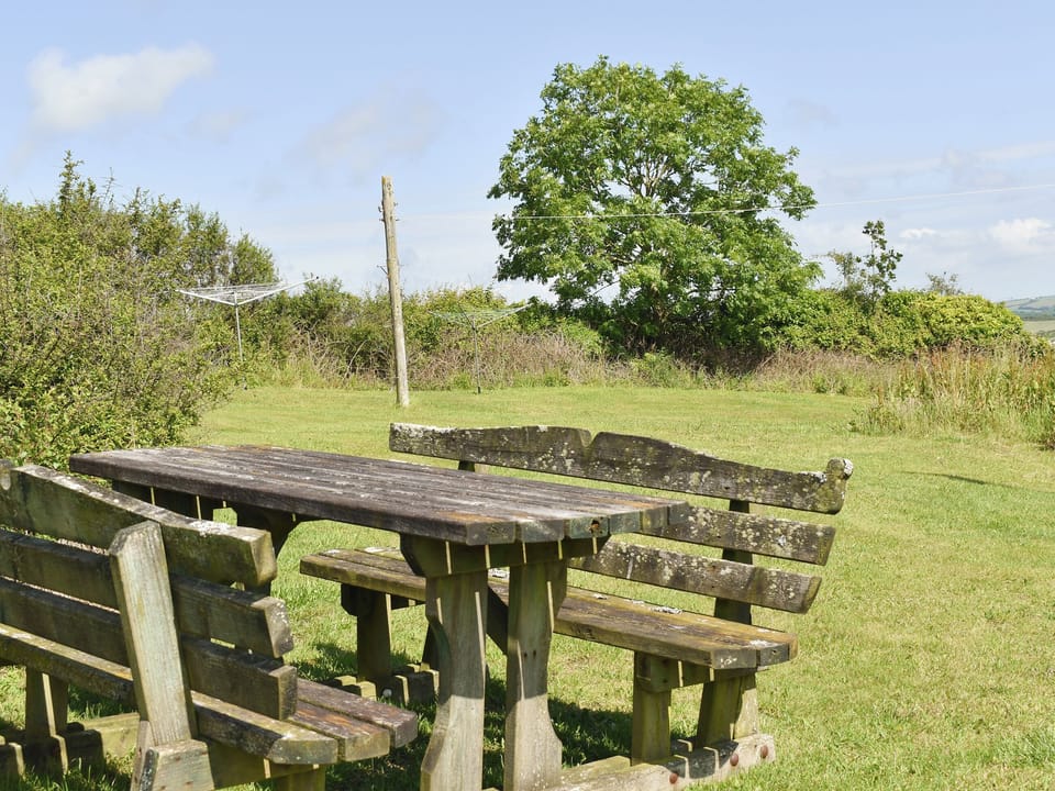 Lawned garden area to rear of property | Haywain - Trentinney Farm Holiday Cottages, St Endellion, near Port Isaac