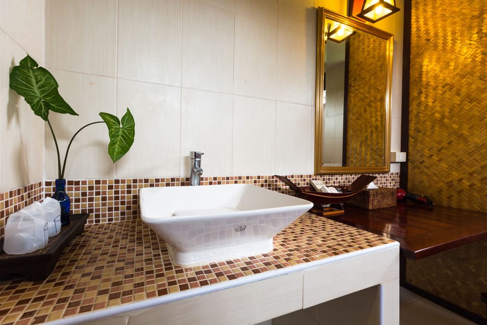 Deluxe Villa, 1 King Bed, Non Smoking, Pool View | Bathroom amenities | Rainfall showerhead, hair dryer, towels
