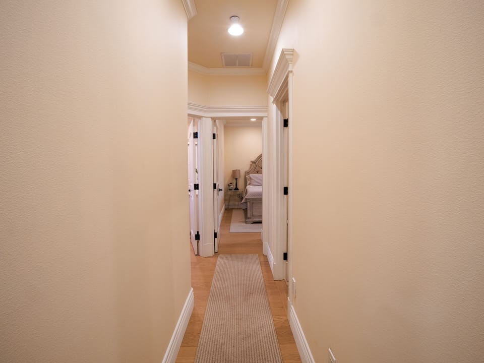 Hallway view taking you back to the bedroom areas.