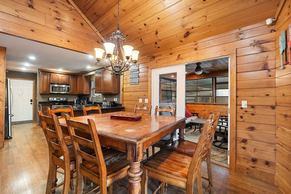 Dining table with a view of enclosed porch