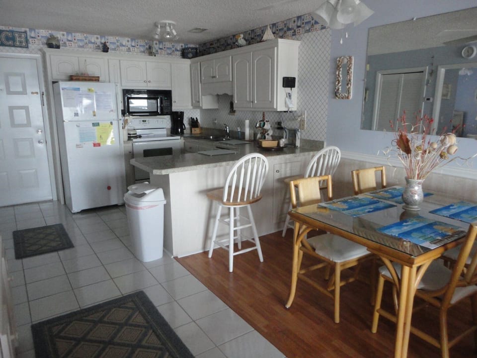 Full view of kitchen and dining table