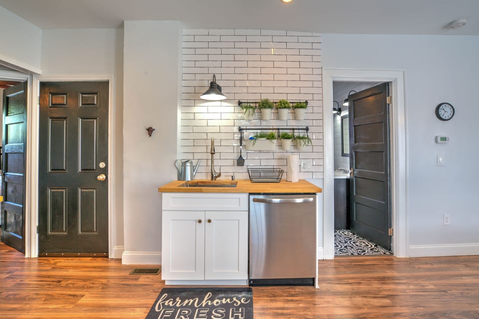 Lower Unit Kitchen, door on left leads to basement with large washer / dryer
