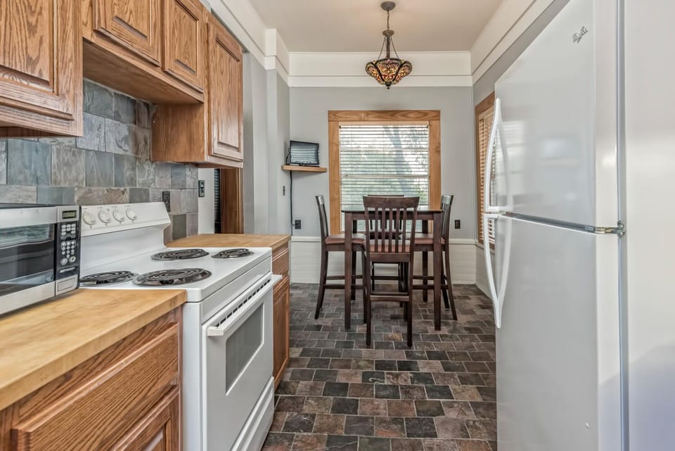 Our upstairs kitchen has a tv and tree-top dinette.