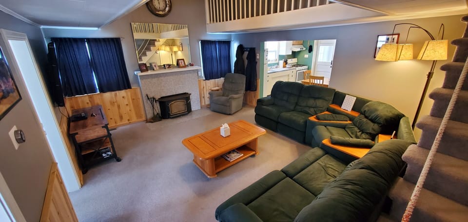Family room. Large screen TV, comfy recliner and sofa, lift top coffee table.