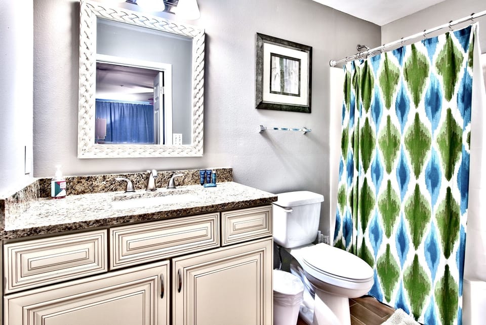 En-suite full bath with shower and tub.