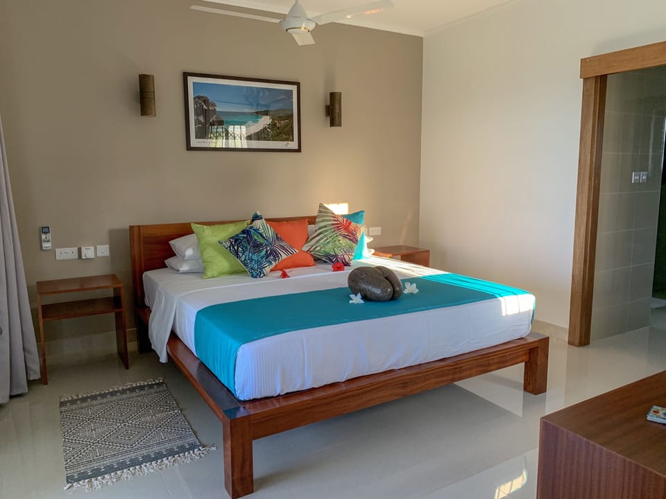 Apartment, 1 Bedroom, Sea View | 1 bedroom, in-room safe, iron/ironing board, bed sheets