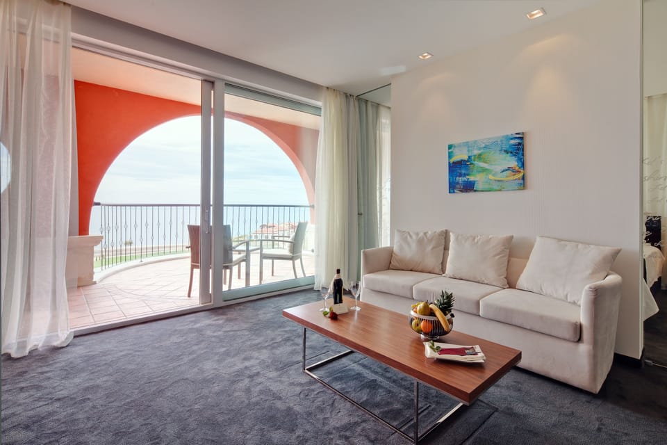 Suite, Sea View | Living area | Flat-screen TV