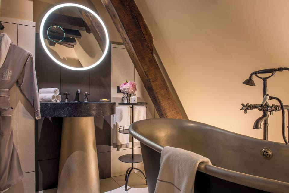 Designer toiletries, hair dryer, bathrobes, slippers