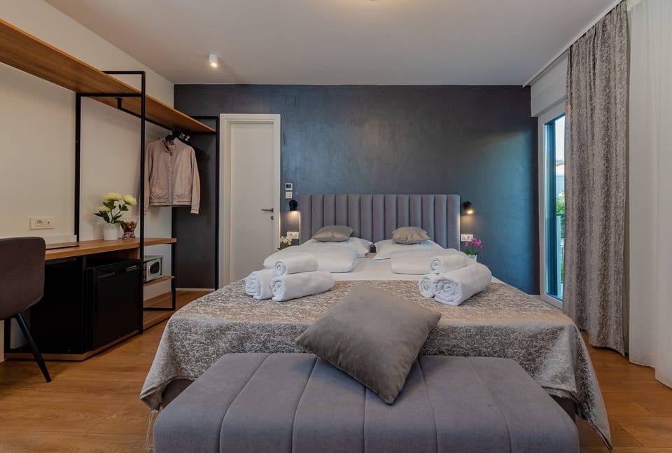 Deluxe Double or Twin Room, Balcony, Garden View | In-room safe, desk, laptop workspace, blackout drapes