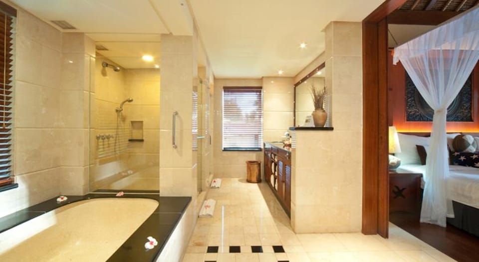 Separate tub and shower, hair dryer, bathrobes, slippers