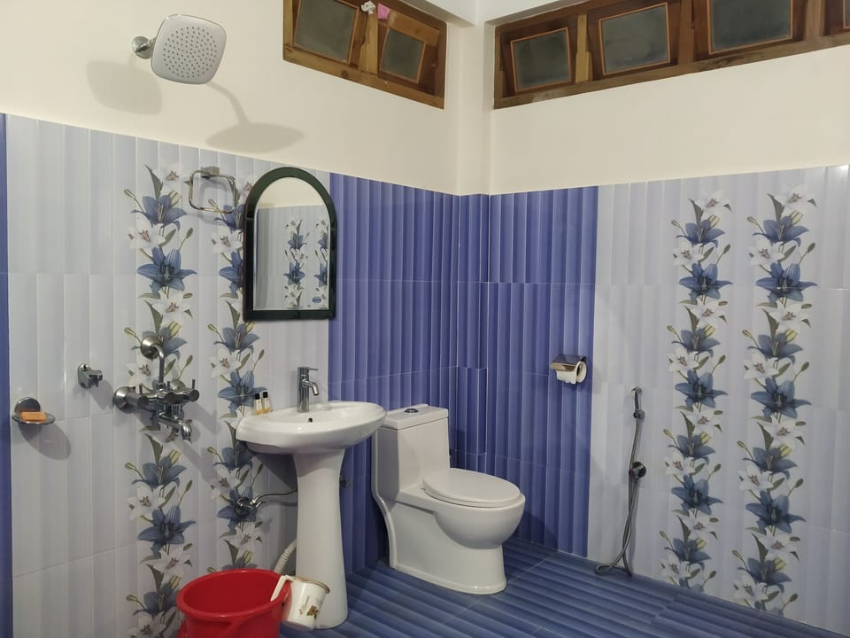Shower, rainfall showerhead, slippers, towels