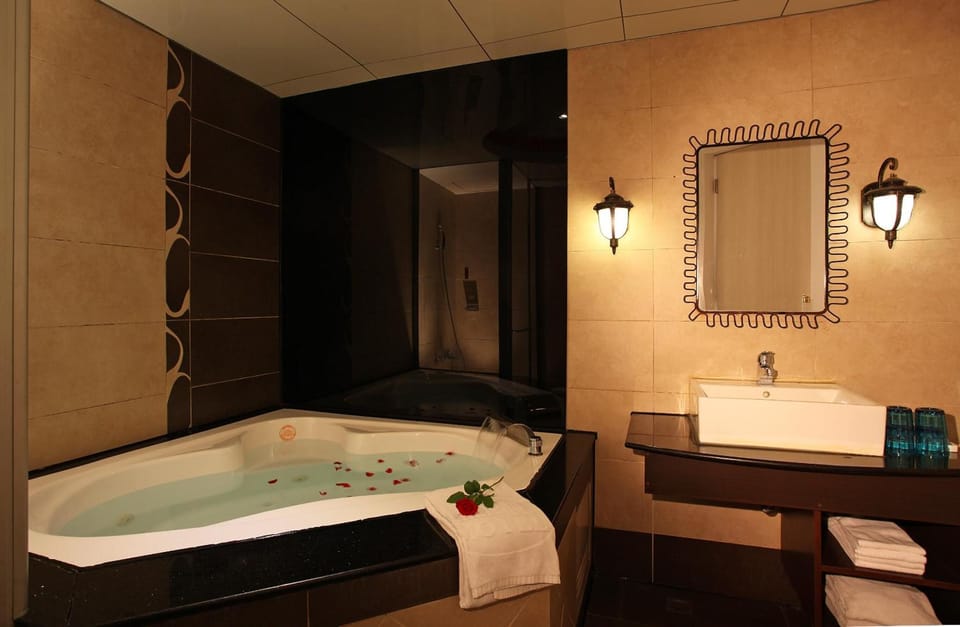 Separate tub and shower, free toiletries, hair dryer, slippers