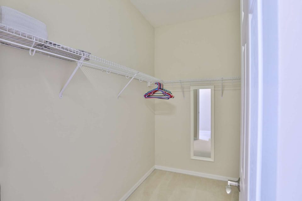 large spacious walk in closet in Master Bedroom