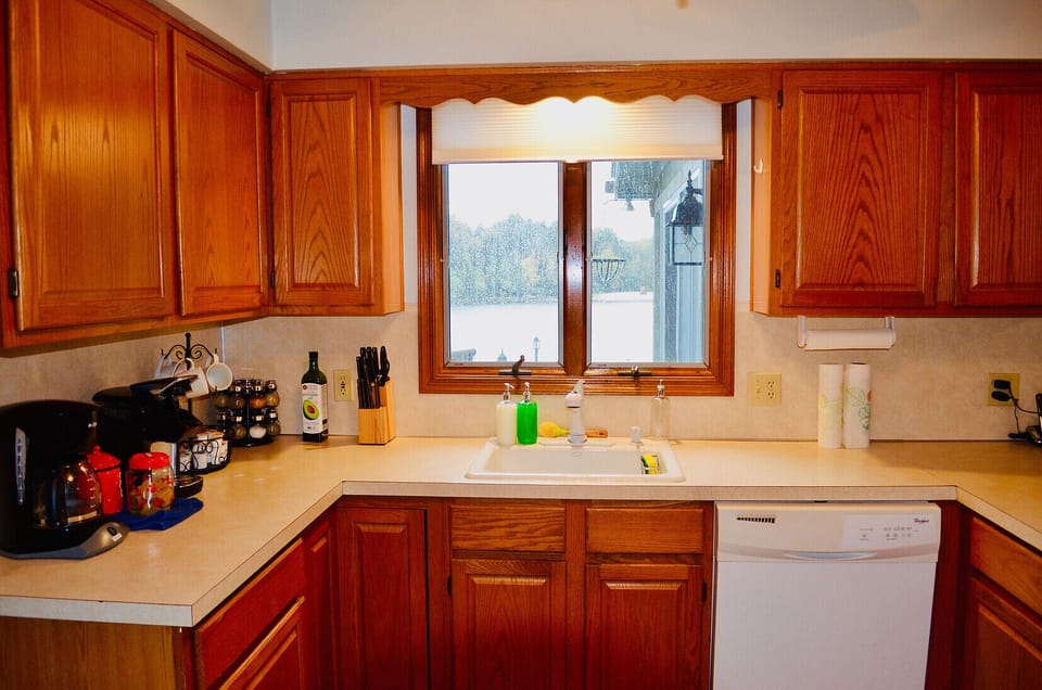 Kitchen with View of Lake during a Sun Shower