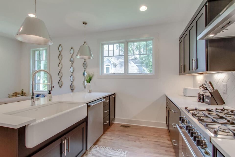 Kitchen showing dark cabinets and stainless steel appliances