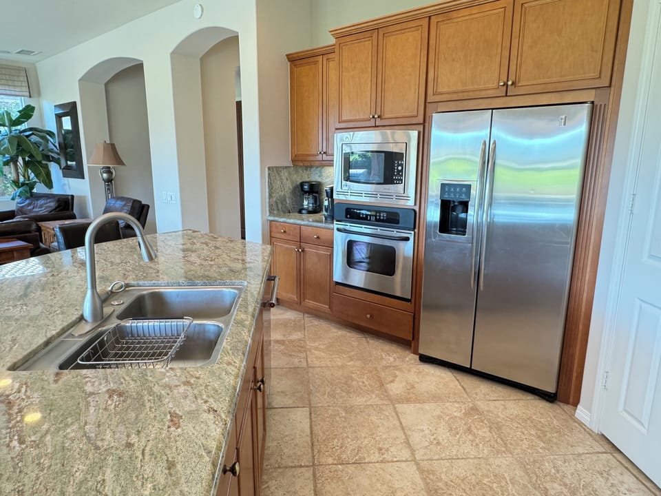 Kithcen has refrig with water and ice, micro, oven, Keurig and pods.
