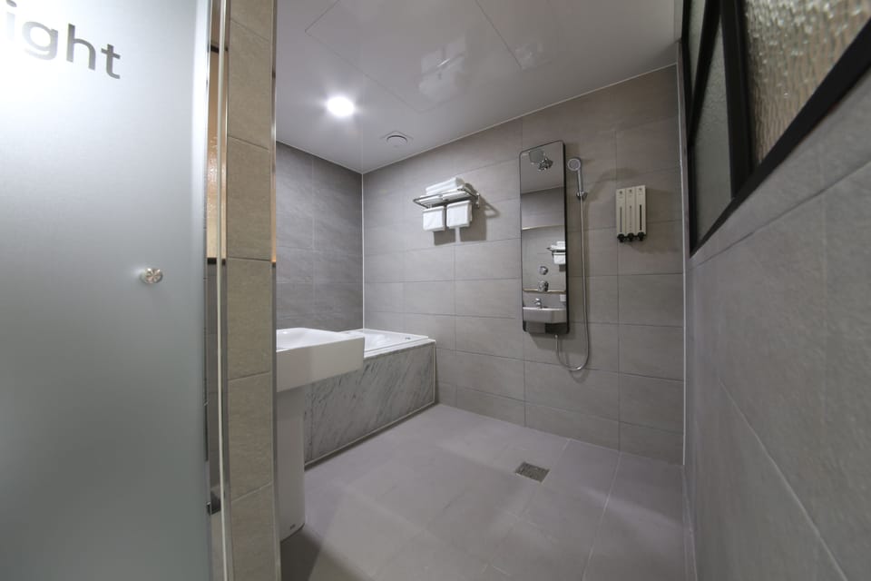 Shower, free toiletries, hair dryer, slippers