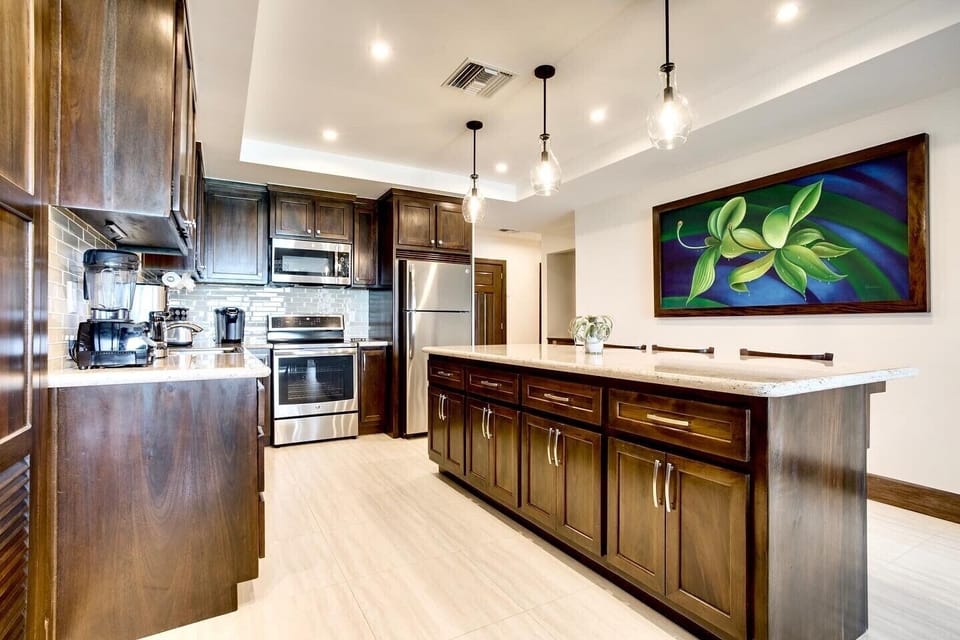 Kitchen includes an 8 foot island with four barstools.