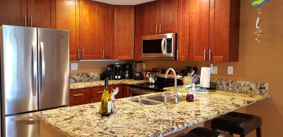Eating in is a pleasure in this remodeled, fully stocked kitchen