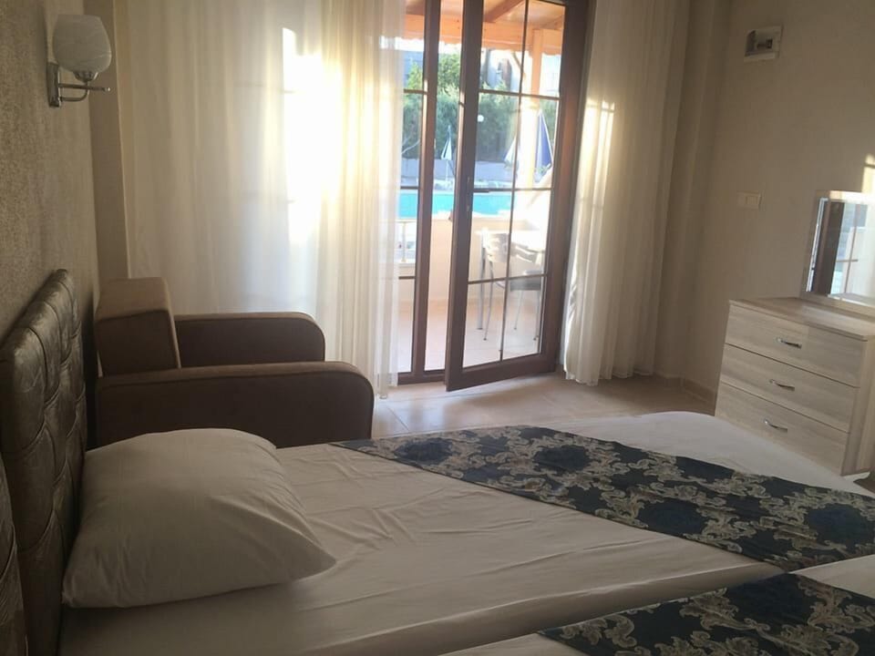 Standard Room, Pool View | Iron/ironing board, WiFi (free), bed sheets