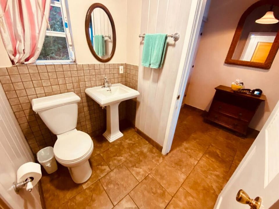 1/2 bathroom located by the front door.