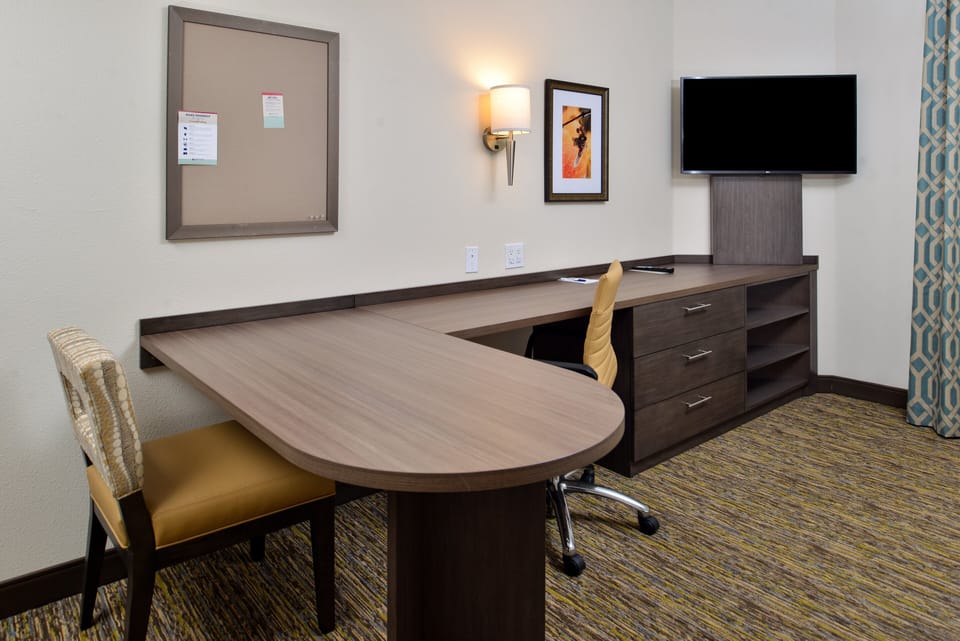 Desk, laptop workspace, blackout drapes, iron/ironing board