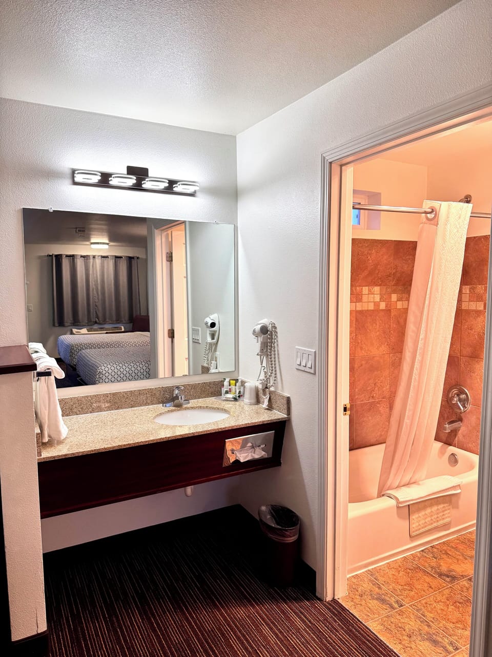 Suite, 1 King Bed | Bathroom | Combined shower/tub, free toiletries, hair dryer, towels