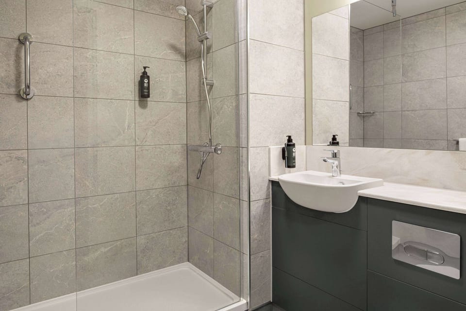 Eco-friendly toiletries, hair dryer, towels, toilet paper