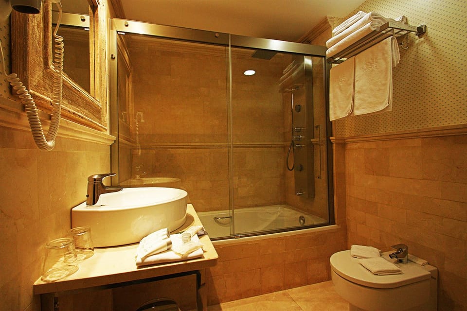 Standard Single Room | Bathroom | Rainfall showerhead, designer toiletries, hair dryer, bidet