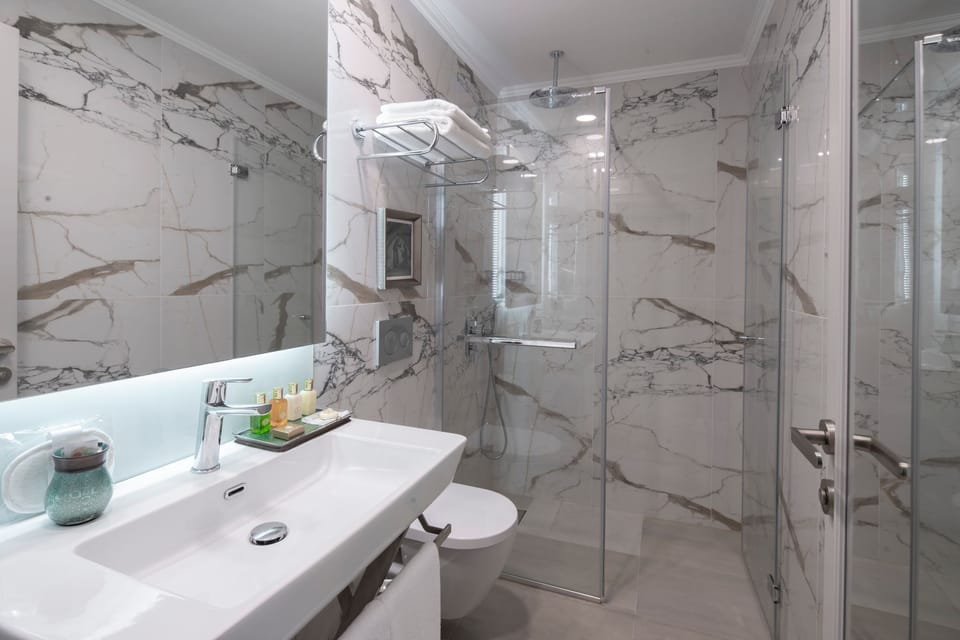Shower, free toiletries, hair dryer, slippers