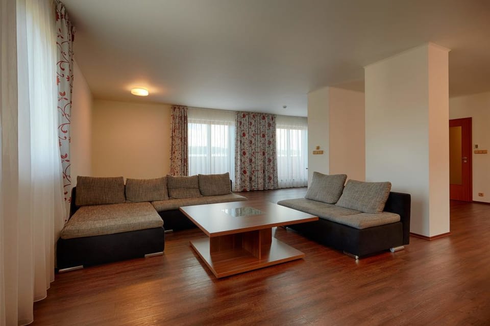 Luxury Suite, Kitchenette | In-room safe, desk, laptop workspace, blackout drapes