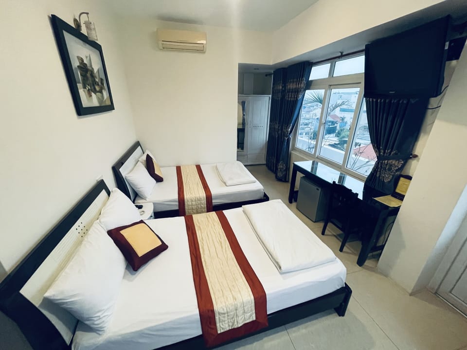 Deluxe Room, Balcony, City View | Minibar, desk, free WiFi