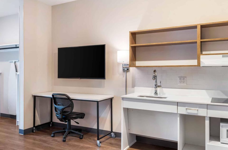 Premium bedding, desk, laptop workspace, iron/ironing board