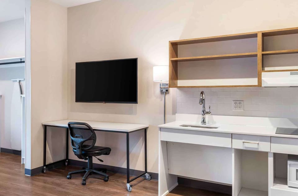 Premium bedding, desk, laptop workspace, iron/ironing board