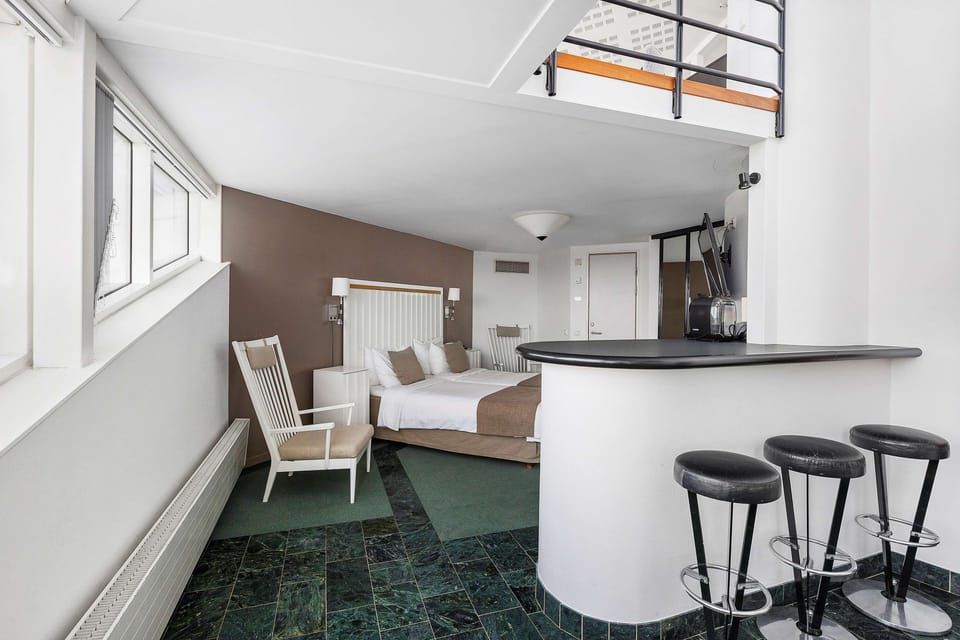 Desk, laptop workspace, blackout drapes, cribs (surcharge)