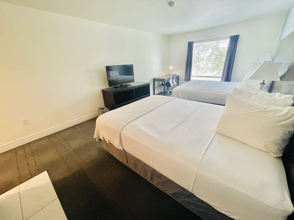 Design Room, 2 Queen Beds, Non Smoking | Individually decorated, individually furnished, desk, laptop workspace