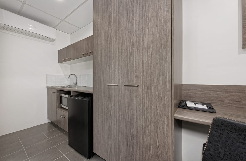 Executive Queen Room (Not Pet Friendly) | Private kitchenette | Coffee/tea maker, fridge, microwave (on request), electric kettle