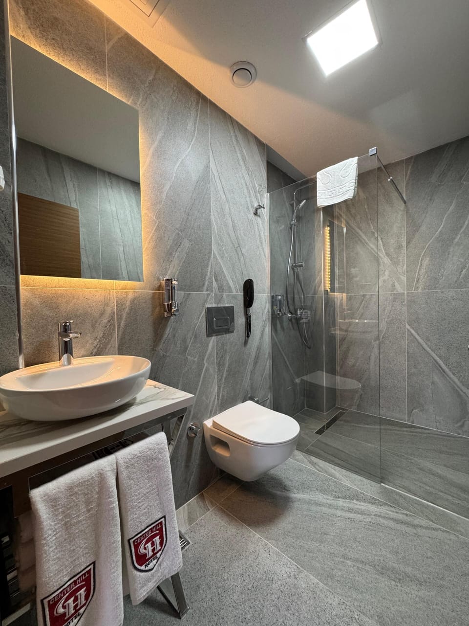 Shower, free toiletries, hair dryer, slippers