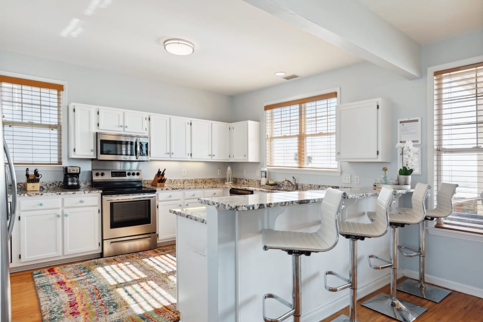 Open kitchen with bar seating