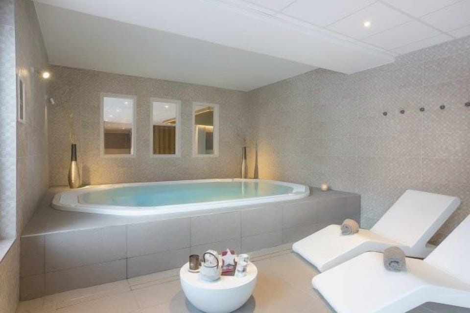 Soak sore muscles in the shared indoor hot tub.