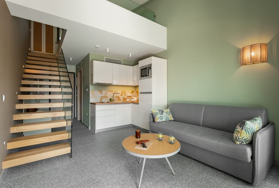 Two Storey Suite | Living area | 43-inch Smart TV with satellite channels, TV
