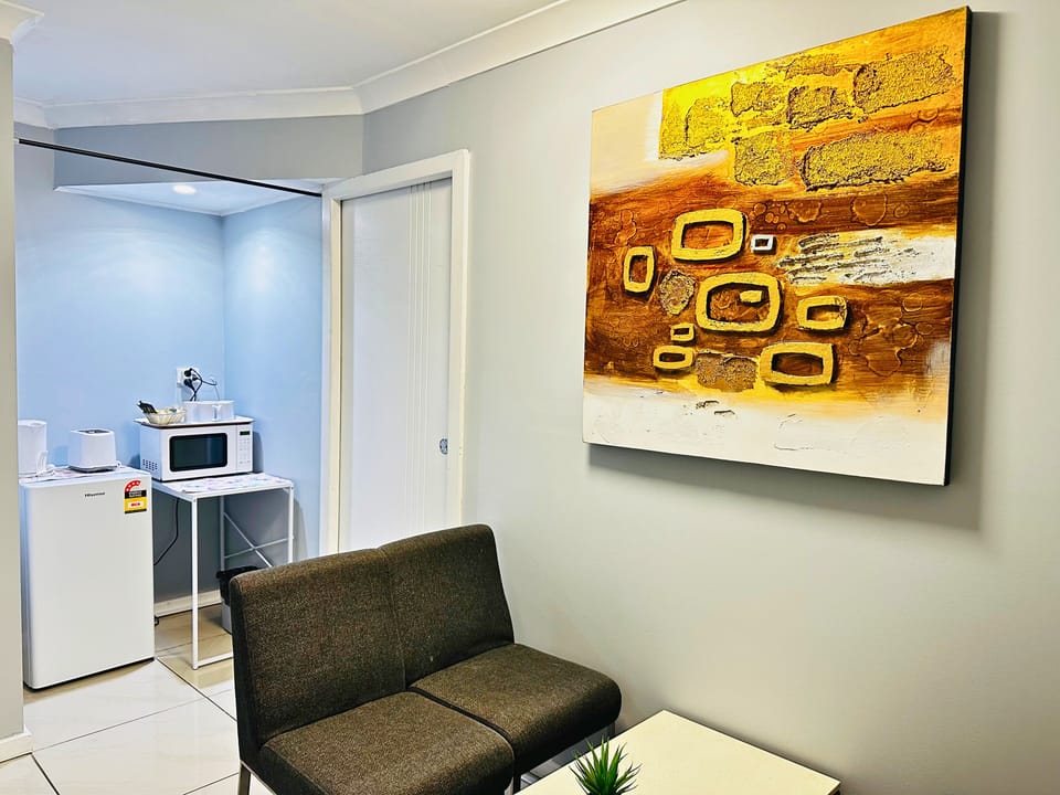 Deluxe Apartment | Living area | 80-cm TV with digital channels